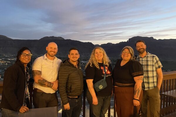 Institute for Coordinated Community Response (ICCR) team travels to Moab, Utah, for a cohort site visit with the Grand County team. From left: Myia Pridgen, Program Manager for NTC & ICCR; Robert Sterry, Moab Police Department Domestic Violence Coordinator; Stephen Stocks, Grand County Attorney; Lacy Hensley, Director of NTC & ICCR; Abi Taylor, Executive Director of Seekhaven; and Nathaniel Clark, Moab Police Department Victim Assistance Unit.